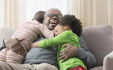 Grandfather goofing around with his grandchildren