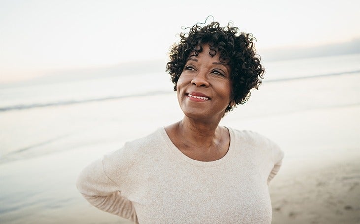 Woman on the beach feeling clarity