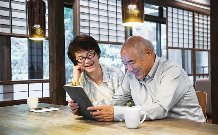 Couple researching on a tablet